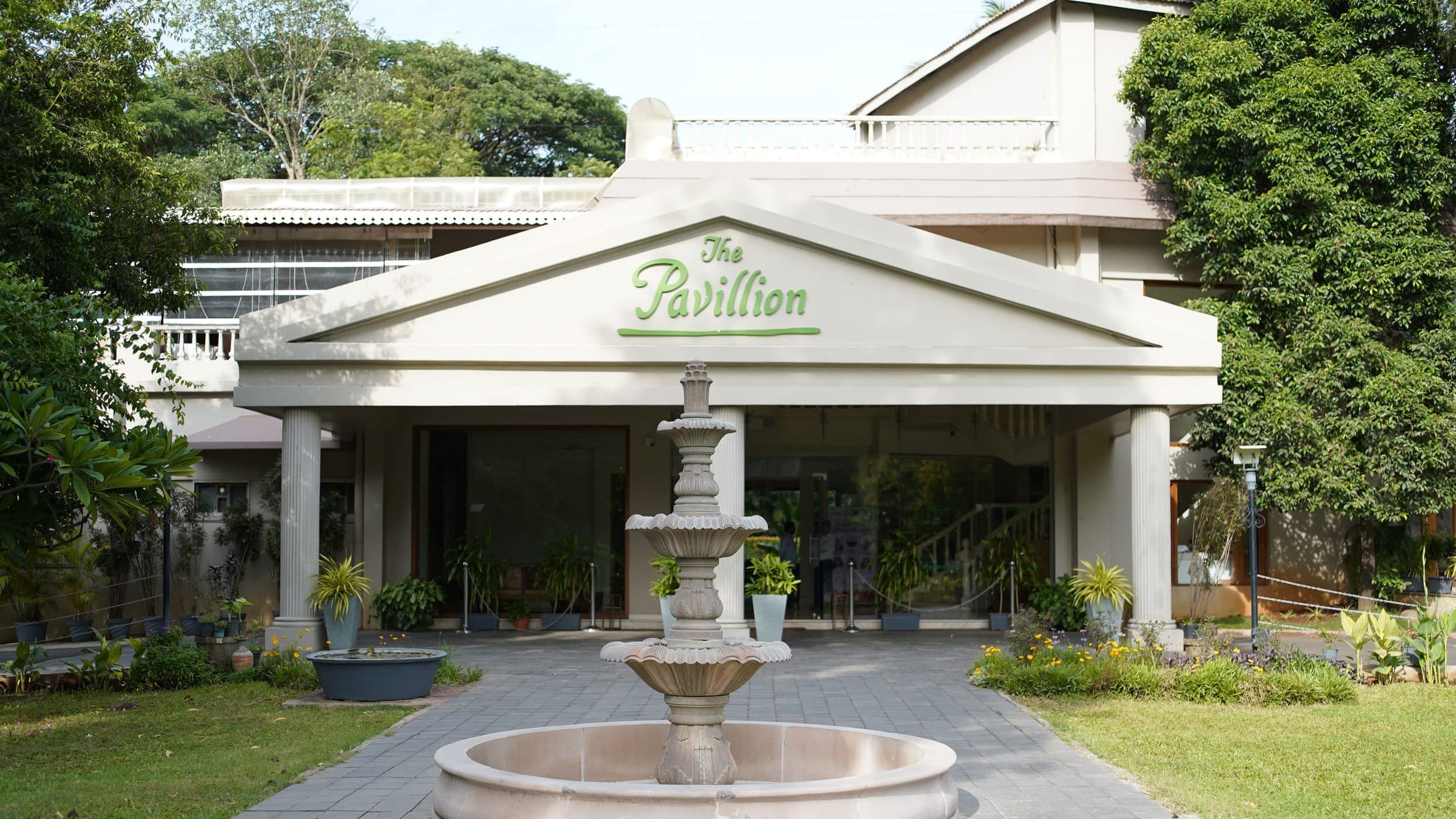 The colonnaded entrance and fountain courtyard at The Pavillion Hotel in Kolhapur